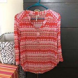 Orange tribal print shirts